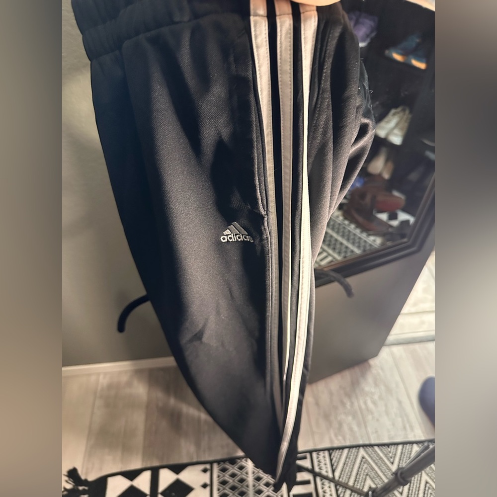 2 pairs Adidas warm up pants, sports, zipper on legs.